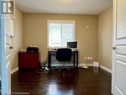 Office space with dark wood-type flooring - 