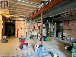 Basement featuring heating unit and water heater - 