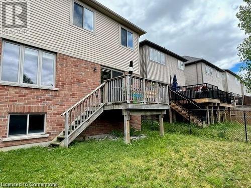 Back of house with a yard and a wooden deck - 683 Robert Ferrie Drive, Kitchener, ON - Outdoor With Deck Patio Veranda With Exterior