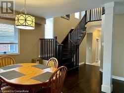 Dining area featuring dark hardwood / wood-style floors - 