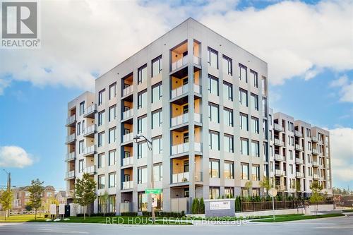 613 - 1440 Clarriage Court, Milton, ON - Outdoor With Balcony With Facade