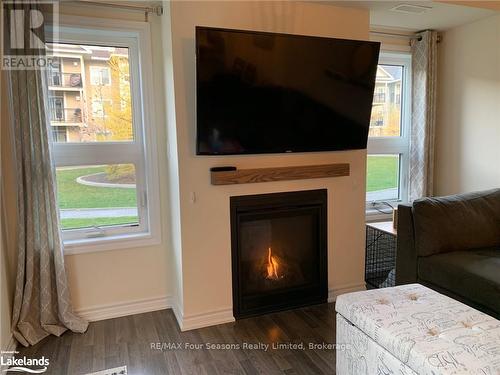 102 - 4 Cove Court, Collingwood, ON - Indoor Photo Showing Living Room With Fireplace