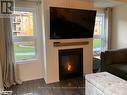 102 - 4 Cove Court, Collingwood, ON  - Indoor Photo Showing Living Room With Fireplace 