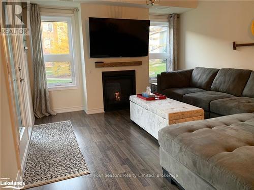 102 - 4 Cove Court, Collingwood, ON - Indoor Photo Showing Living Room With Fireplace