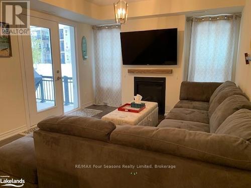 102 - 4 Cove Court, Collingwood, ON - Indoor Photo Showing Living Room With Fireplace