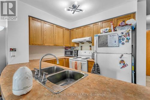 2103 - 60 Brian Harrison Way, Toronto, ON - Indoor Photo Showing Kitchen With Double Sink