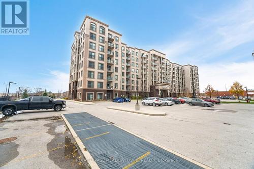 406 - 2490 Old Bronte Road E, Oakville, ON - Outdoor With Facade