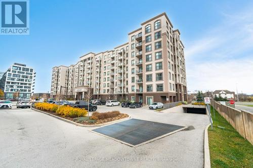 406 - 2490 Old Bronte Road E, Oakville, ON - Outdoor With Balcony With Facade