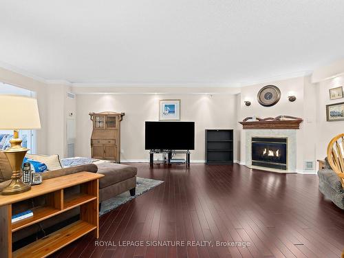 1122-10 Guildwood Pkwy, Toronto, ON - Indoor Photo Showing Living Room With Fireplace