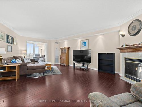 1122-10 Guildwood Pkwy, Toronto, ON - Indoor Photo Showing Living Room With Fireplace