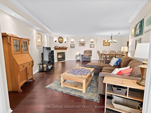 1122-10 Guildwood Pkwy, Toronto, ON - Indoor Photo Showing Living Room With Fireplace