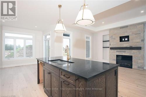 15 Kastner Street, Stratford (Ellice), ON - Indoor Photo Showing Kitchen With Fireplace With Double Sink