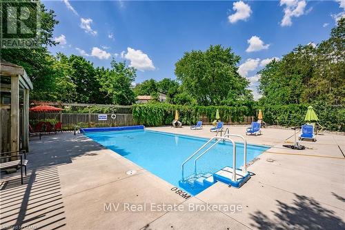 402 - 93 Westwood Road, Guelph (West Willow Woods), ON - Outdoor With In Ground Pool With Backyard