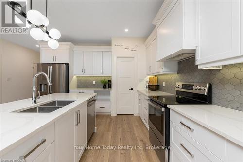 38 Faith Drive, Mapleton (Drayton), ON - Indoor Photo Showing Kitchen With Stainless Steel Kitchen With Double Sink With Upgraded Kitchen