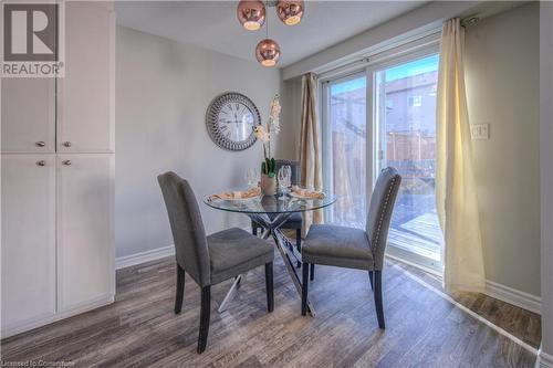 Dining space with dark hardwood / wood-style flooring - 83 Bridlewreath Street, Kitchener, ON - Indoor Photo Showing Dining Room