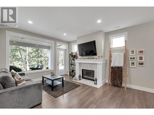 224 Lost Creek Court, Kelowna, BC - Indoor Photo Showing Living Room With Fireplace