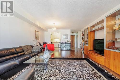 309 - 162 Martindale Road, St. Catharines (453 - Grapeview), ON - Indoor Photo Showing Living Room With Fireplace