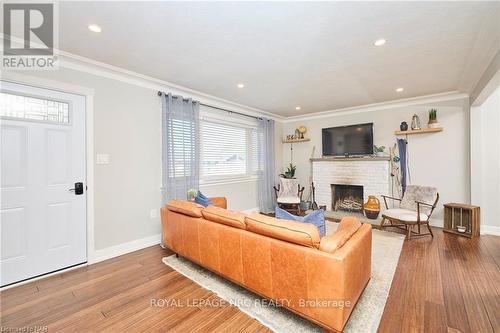 12 Corbett Avenue, St. Catharines (438 - Port Dalhousie), ON - Indoor Photo Showing Living Room With Fireplace