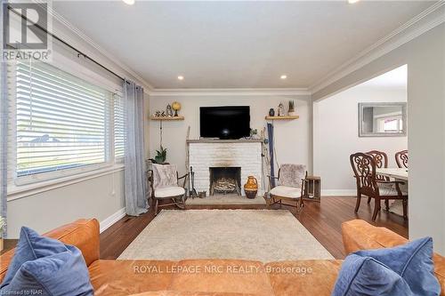 12 Corbett Avenue, St. Catharines (438 - Port Dalhousie), ON - Indoor Photo Showing Living Room With Fireplace