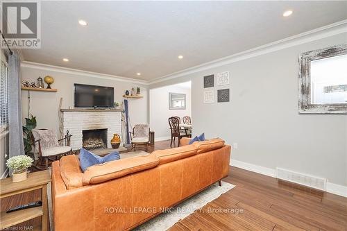 12 Corbett Avenue, St. Catharines (438 - Port Dalhousie), ON - Indoor Photo Showing Living Room With Fireplace