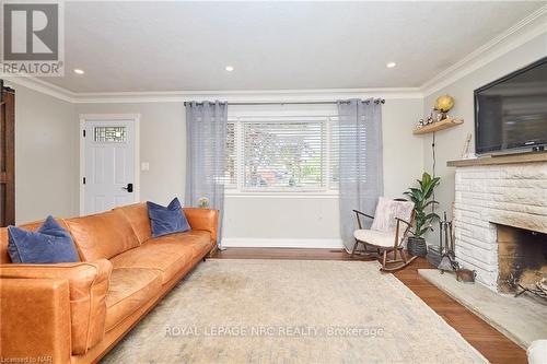 12 Corbett Avenue, St. Catharines (438 - Port Dalhousie), ON - Indoor Photo Showing Living Room With Fireplace