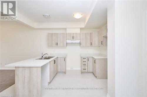 23 - 397 Garrison Road, Fort Erie (333 - Lakeshore), ON - Indoor Photo Showing Kitchen With Double Sink