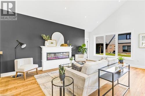 7490 Sherrilee Crescent, Niagara Falls (222 - Brown), ON - Indoor Photo Showing Living Room With Fireplace