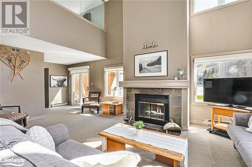 204 - 169 Jozo Weider Boulevard, Blue Mountains (Blue Mountain Resort Area), ON - Indoor Photo Showing Living Room With Fireplace