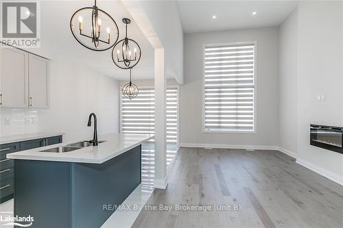 5 Rosanne Circle, Wasaga Beach, ON - Indoor Photo Showing Kitchen With Fireplace With Double Sink