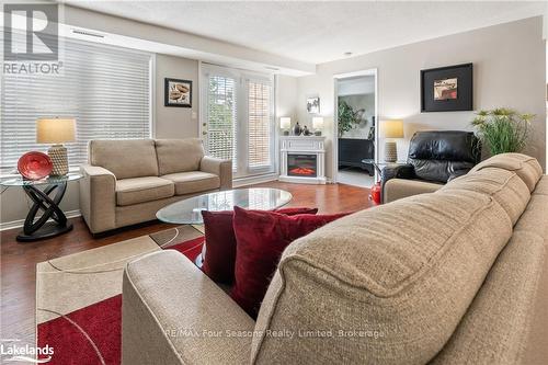 A405 - 216 Plains Road W, Burlington (Bayview), ON - Indoor Photo Showing Living Room With Fireplace