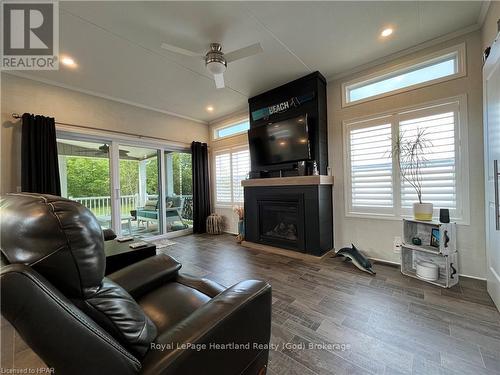 Lot 91 - 77683 Bluewater, Central Huron (Bayfield), ON - Indoor Photo Showing Living Room With Fireplace