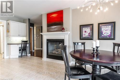 55 Stoneridge Boulevard, St. Marys, ON - Indoor Photo Showing Dining Room With Fireplace