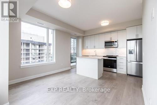 1904 - 3220 William Coltson Avenue, Oakville, ON - Indoor Photo Showing Kitchen With Stainless Steel Kitchen