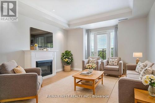 420 - 3351 Cawthra Road, Mississauga, ON - Indoor Photo Showing Living Room With Fireplace