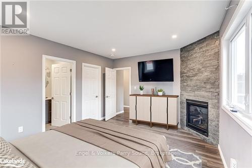 4 Burd Street, Parry Sound, ON - Indoor Photo Showing Bedroom With Fireplace