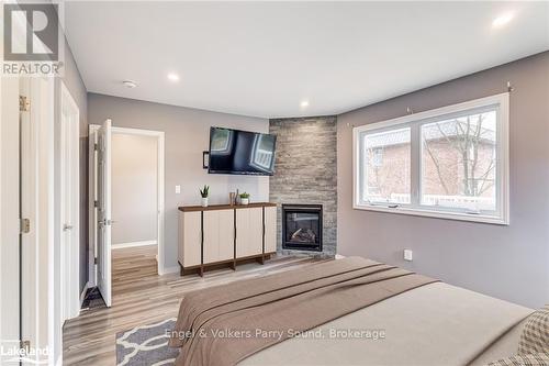 4 Burd Street, Parry Sound, ON - Indoor Photo Showing Bedroom With Fireplace