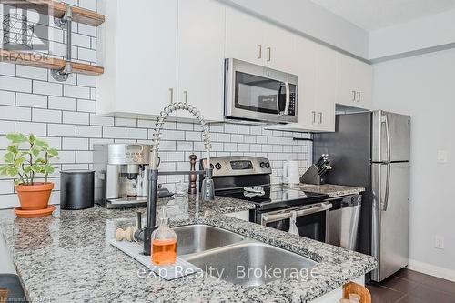 801 - 53 Arthur Street S, Guelph (Two Rivers), ON - Indoor Photo Showing Kitchen With Stainless Steel Kitchen With Double Sink With Upgraded Kitchen