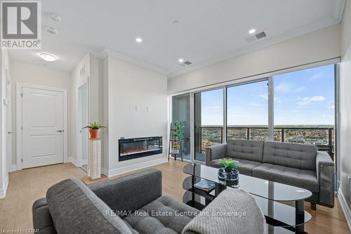 905 - 1878 Gordon Street, Guelph (Guelph South), ON - Indoor Photo Showing Living Room With Fireplace