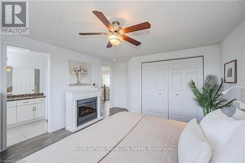 173 Clair Road W, Guelph (Clairfields), ON - Indoor Photo Showing Bedroom With Fireplace