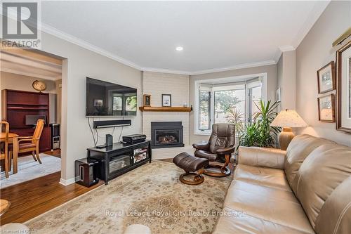 106 - 121 Waterloo Avenue, Guelph (Central West), ON - Indoor Photo Showing Living Room With Fireplace