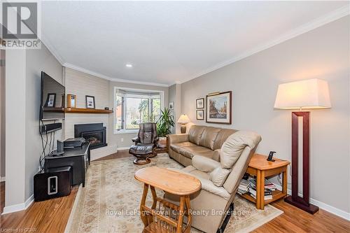 106 - 121 Waterloo Avenue, Guelph (Central West), ON - Indoor Photo Showing Living Room With Fireplace