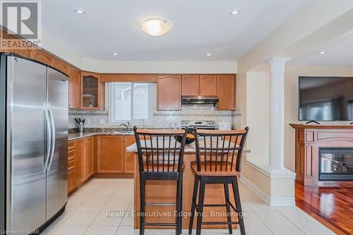 67 Revell Drive, Guelph (Hanlon Industrial), ON - Indoor Photo Showing Kitchen With Fireplace With Double Sink