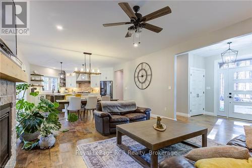 211721 Baseline, West Grey, ON - Indoor Photo Showing Living Room With Fireplace