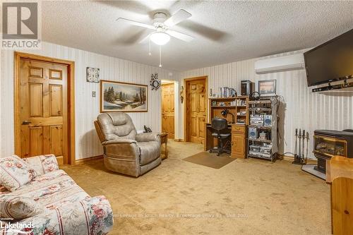 682 Concession 15 Road W, Tiny, ON - Indoor Photo Showing Living Room With Fireplace