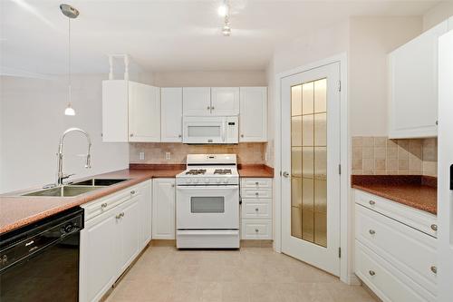 112-1330 Ridgeway Drive, Kelowna, BC - Indoor Photo Showing Kitchen With Double Sink