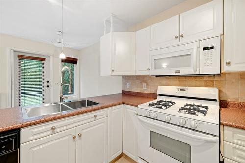 112-1330 Ridgeway Drive, Kelowna, BC - Indoor Photo Showing Kitchen With Double Sink