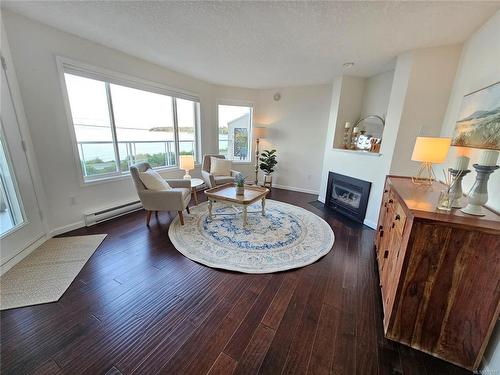 103-3156 Island Hwy West, Qualicum Beach, BC - Indoor Photo Showing Living Room With Fireplace