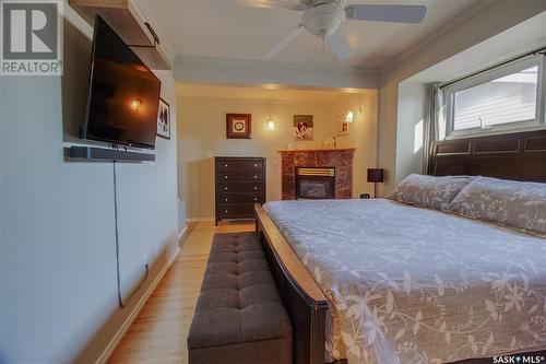 2325 Clarence Avenue S, Saskatoon, SK - Indoor Photo Showing Bedroom With Fireplace