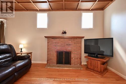 27 Meadow Street, Whitewater Region, ON - Indoor Photo Showing Living Room With Fireplace