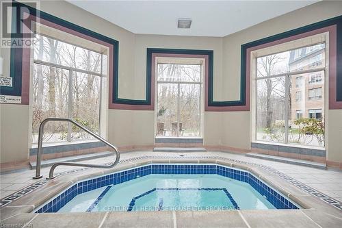 427 - 8111 Forest Glen Drive, Niagara Falls (208 - Mt. Carmel), ON - Indoor Photo Showing Other Room With In Ground Pool